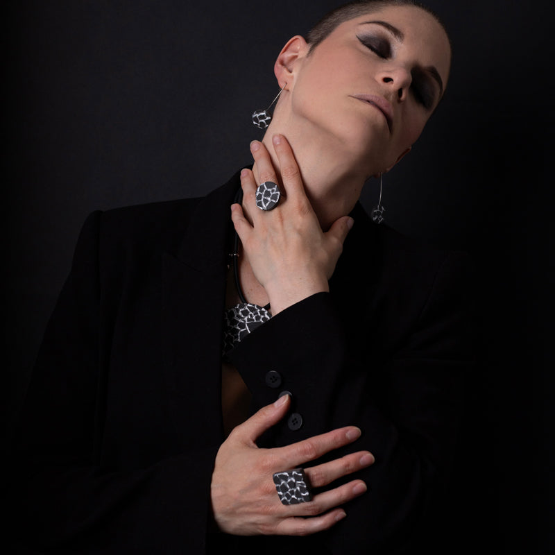 Patti black and silver round ring