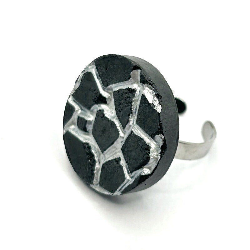 Patti black and silver round ring