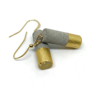 short cylindrical earrings in concrete and 24 carat gold leaf Luna by Icy Mouse