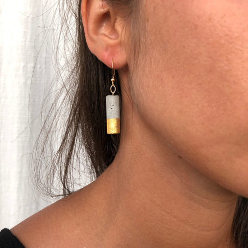 short cylindrical earrings in concrete and 24 carat gold leaf Luna by Icy Mouse